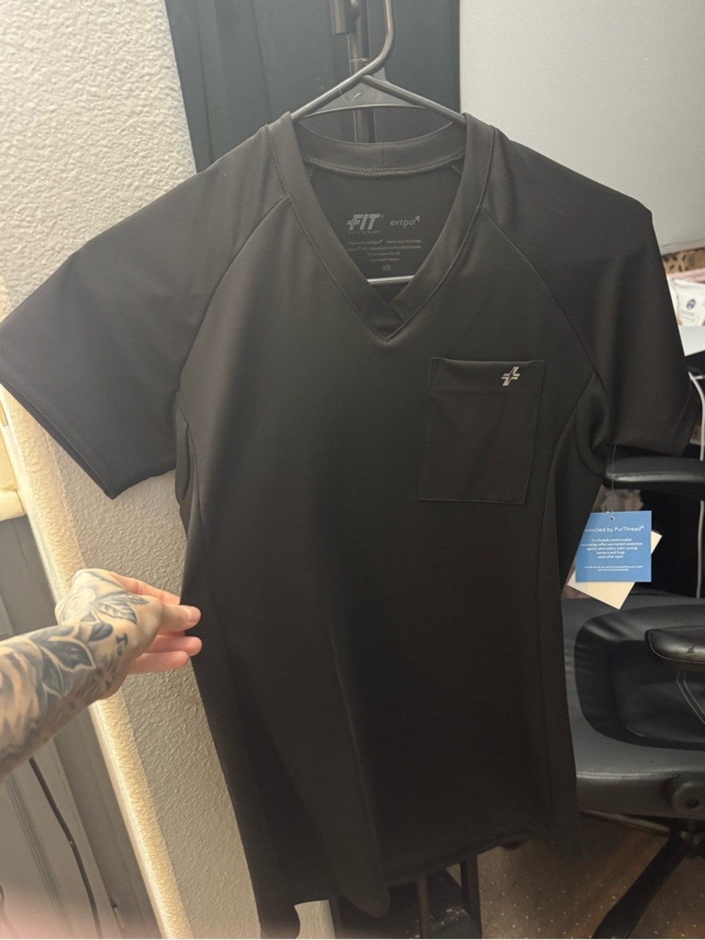 FIT scrubs women scrub top. New with tags. Stretchy spandex-like material.